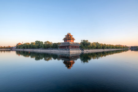 Beautiful water reflection of Forbidden City Corner Tower or Jiaolou in Beijing, China. Corner Towers stand in the 4 corners of the Forbidden City, each with 3-layer of complex roof.の写真素材