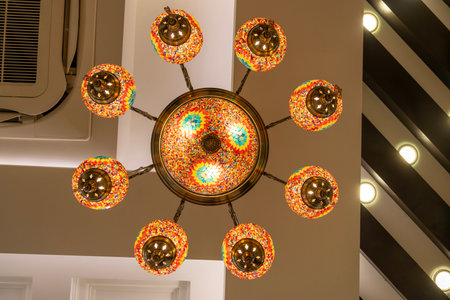 Colorful Moroccan style lanterns lamp hanging down from ceiling.の写真素材