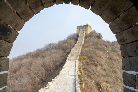 View of Simatai Great Wall through the watch tower window in Beijing, China. Simatai Great Wall is one of the most significant sections of the Ming Great Wallの写真素材