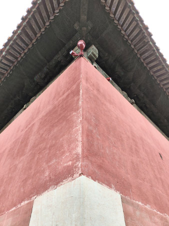 Red wall of The Forbidden City in Beijing, China. Forbidden City is surrounded by a 7.9m high city wall and a 6m deep by 52m wide moatの写真素材