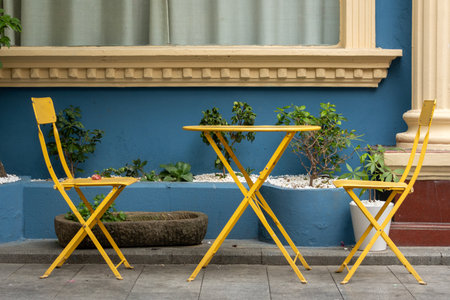 Vibrant yellow color chairs and table at the street.の写真素材