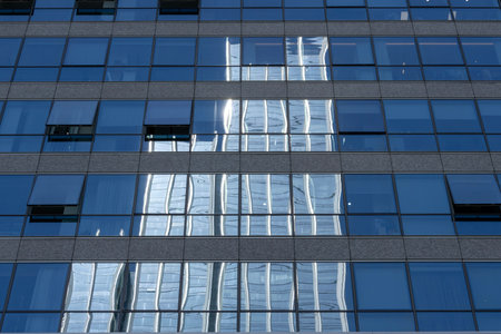 Reflection of a high-rise office building on the blue window in Shenzhen, China.