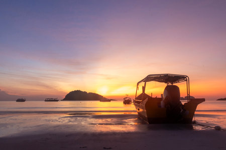 Breathtaking sunrise captured on Redang Island, Malaysia. Radiant sun light and colourful sky, enhancing the natural beautyの写真素材