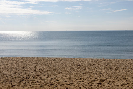 Beautiful beach with sand, turquoise ocean and blue sky. Sand, sea and blue sky.の写真素材