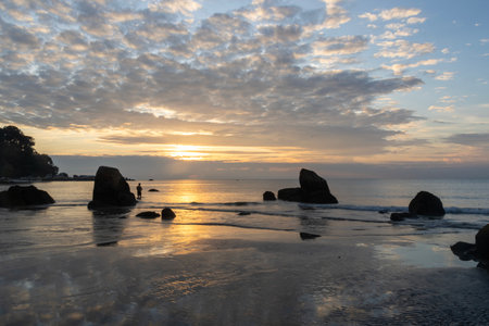 Sunrise at Teluk Cempedak, also known as Palm Beach, which is located in Kuantan, Malaysiaの写真素材