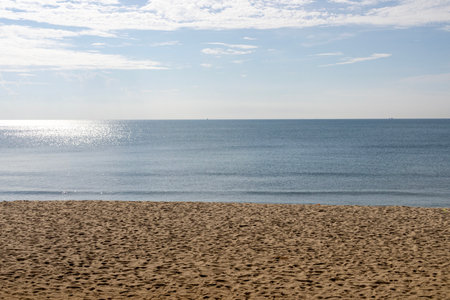 Beautiful beach with sand, turquoise ocean and blue sky. Sand, sea and blue sky.の写真素材