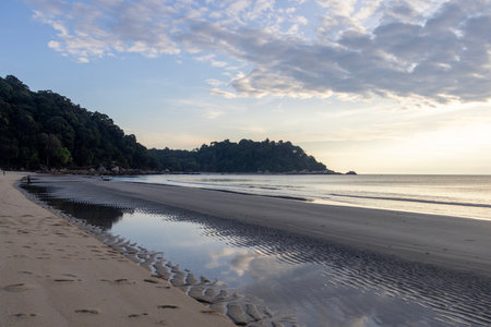 Morning in Teluk Cempedak beach in Kuantan, Malaysia.の写真素材