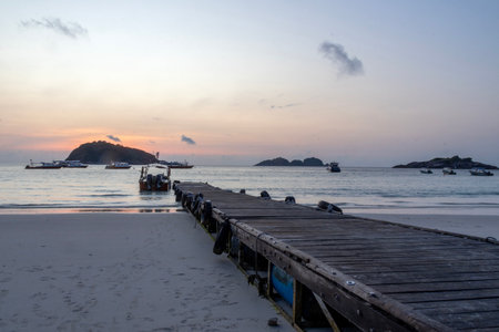 Beautiful sunrise with wooden jetty at Redang Island, Malaysiaの写真素材