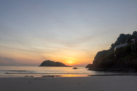 Breathtaking sunrise captured on Redang Island, Malaysia. Radiant sun light and colourful sky, enhancing the natural beautyの写真素材