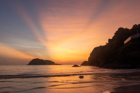 Breathtaking sunrise captured on Redang Island, Malaysia. Radiant sun light and colourful sky, enhancing the natural beautyの写真素材