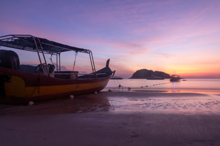 Breathtaking sunrise captured on Redang Island, Malaysia. Radiant sun light and colourful sky, enhancing the natural beautyの写真素材