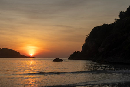 Breathtaking sunrise captured on Redang Island, Malaysia. Radiant sun light and colourful sky, enhancing the natural beautyの写真素材