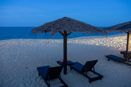 View of Teluk Cempedak Beach at night in Kuantan, Malaysia. Teluk Cempedak Beach is known for its clear blue waters and fine white sandy shoresの写真素材