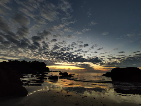 Sunrise at Teluk Cempedak, also known as Palm Beach, which is located in Kuantan, Malaysiaの写真素材