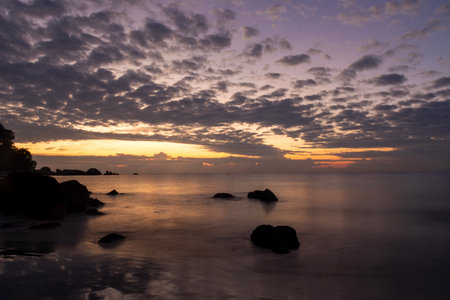 Sunrise at Teluk Cempedak, also known as Palm Beach, which is located in Kuantan, Malaysiaの写真素材