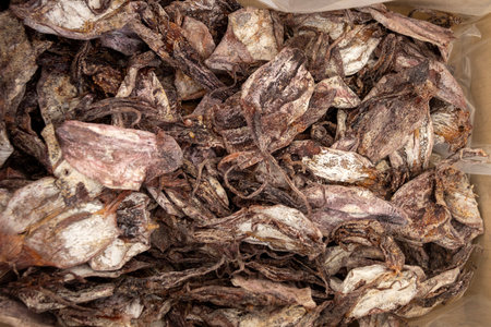 Dried squid sold on the market. Dried squids have sweet taste and strong aromaの写真素材