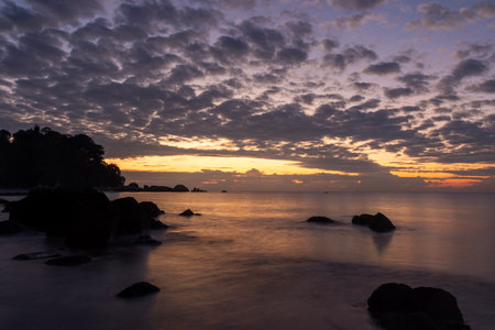 Sunrise at Teluk Cempedak, also known as Palm Beach, which is located in Kuantan, Malaysiaの写真素材