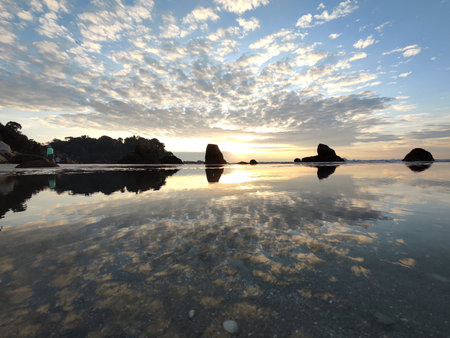 Sunrise at Teluk Cempedak, also known as Palm Beach, which is located in Kuantan, Malaysiaの写真素材