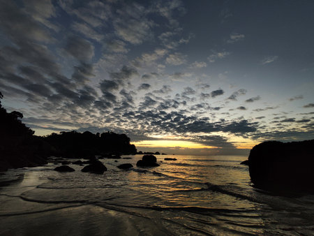Sunrise at Teluk Cempedak, also known as Palm Beach, which is located in Kuantan, Malaysiaの写真素材