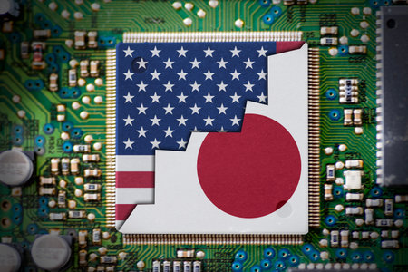 USA and Japan flags on microchips. Indicate the competition on electronics technologyの写真素材