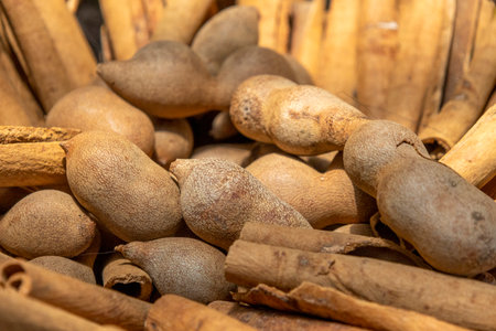 Dried tamarind fruit. The pulp of the tamarind fruit is intensely sour, with a tangy taste that is reminiscent of citrus fruitsの写真素材