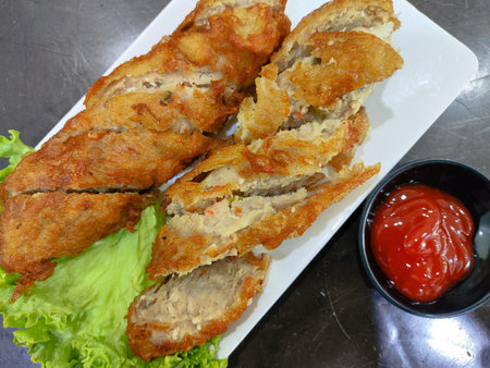 Deep-fried meat roll on a plate