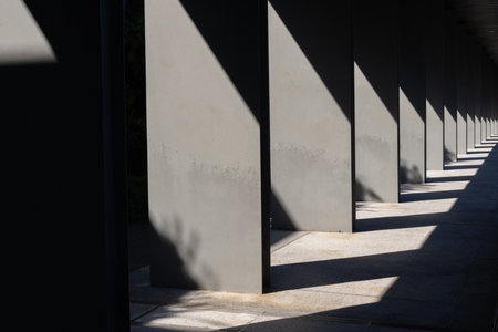 Sunlight and black shadows on the pillar form a beautiful patternの写真素材