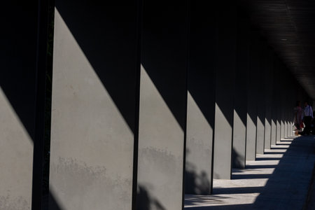 Sunlight and black shadows on the pillar form a beautiful patternの写真素材