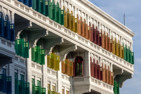 The colorful windows are on the Old Hill Street Police Station in Singapore. The building has a total of 927 windows and they are painted in the colours of the rainbowの写真素材