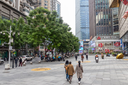 Chongqing, China- 11 Nov 2025: View of the CDB area of Chongqing city in China. It is known for its vibrant nightlife, shopping, and dining, with a landmark monument.のeditorial素材
