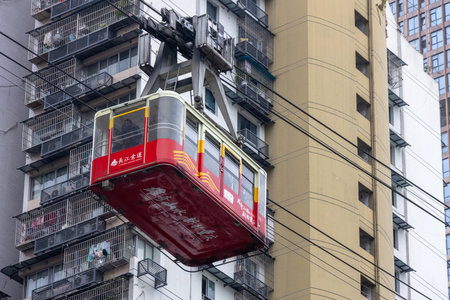 Chongqing, China- 11 Nov 2025: Cable car of Yangtze River Cableway travels along the city in Chongqing, China. The Cableway has developed into a must-visit attraction for tourists in Chongqing.のeditorial素材
