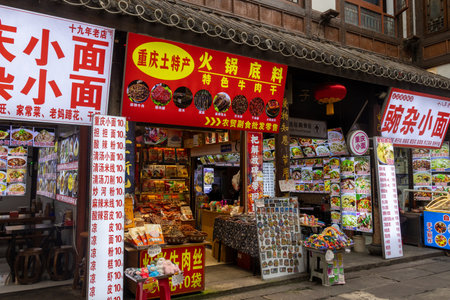 Chongqing, China- 11 Nov 2025: Hongyadong Folk Custom Scene Area in Chongqing, China. It is an 11-story stilt-building complex in the main commercial districtのeditorial素材