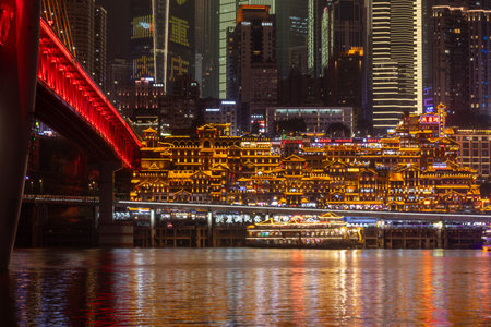Chongqing, China- 8 Nov 2025: Night view of Chongqing city in China with Qiansimen bridge and Hongyadong Scenic Area. It offering breathtaking views of Chongqing's multi-layered urban landscapeのeditorial素材