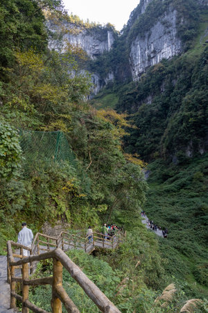 Chongqing, China-4 Nov 2025: Tourists visit to Three Natural Bridges at Wulong Karst Geological Park, Chongqing. It is natural limestone arches situated in a deep canyon, carved by flowing water.のeditorial素材