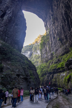 Chongqing, China-4 Nov 2025: Tourists visit to Three Natural Bridges at Wulong Karst Geological Park, Chongqing. It is natural limestone arches situated in a deep canyon, carved by flowing water.のeditorial素材