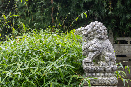 Guardian lion statues in the garden of Dazu Rock Carvings on Mount Baoding, Dazu, Chinaの写真素材