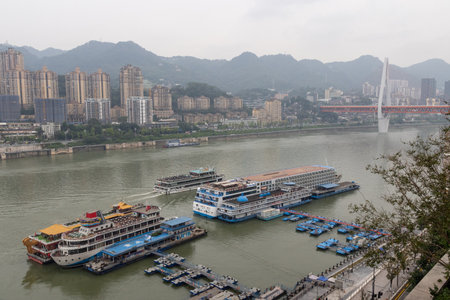 Chongqing, China- 2 Nov 2025: Wharfs and decks located along the river in Chongqing, China. Tourists and passengers take the cruises at night to enjoy the night scene of Chongqing.のeditorial素材