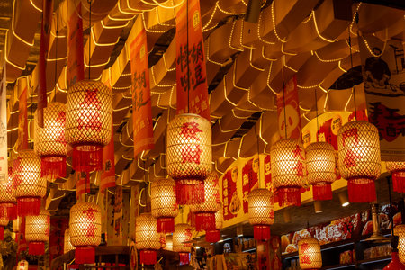 Chongqing, China- 11 Nov 2025: Traditional lanterns hang on the ceiling for decoration in a shopのeditorial素材