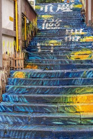 Chongqing, China- 11 Nov 2025: Colourful staircase painted with attractive color in Ciqikou Ancient Town in Chongqing, China. It is a lively ancient town filled with street food and local snacks,のeditorial素材