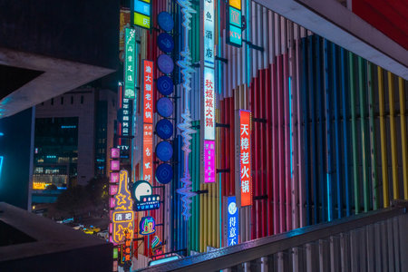 Chongqing, China- 10 Nov 2025: Illuminated by dazzling LED-neon sign, Deyi World in Chongqing, China. It is famous for its unique, multi-layered architecture and Cyberpunk City.のeditorial素材