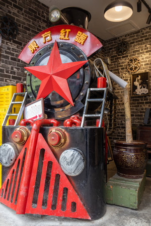 Chongqing, China- 10 Nov 2025: Old retro automotive train display in a shop at Ciqikou Ancient Town in Chongqing, China.のeditorial素材