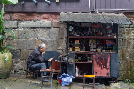 Chongqing, China- 10 Nov 2025: Roadside locksmith stall at Ciqikou Ancient Town in Chongqing, China. Ciqikou, also known as Porcelain Port, is a charming and well-preserved ancient townのeditorial素材