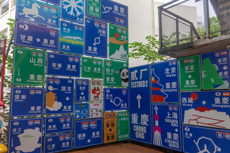 Chongqing, China- 7 Nov 2025: Wall of road sign indicated various places in China. Located at Erchang Culture and Creative Park in Chongqing, Chinaのeditorial素材