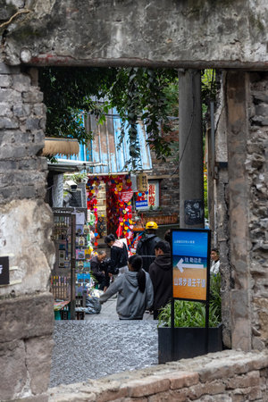 Chongqing, China- 11 Nov 2025: Tourists visit to Shancheng Alley or Mountain City Alley in Chongqing, China. It is a historic and scenic network of stepped lanes, exemplifies mountain city identityのeditorial素材