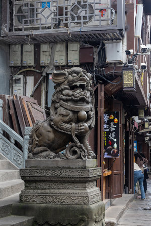Chongqing, China- 11 Nov 2025: Chinese guardian lion located in front of temple in Chongqing, China. It symbolize protection and prosperityのeditorial素材