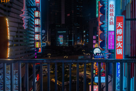 Chongqing, China- 10 Nov 2025: Illuminated by dazzling LED-neon sign, Deyi World in Chongqing, China. It is famous for its unique, multi-layered architecture and Cyberpunk City.のeditorial素材