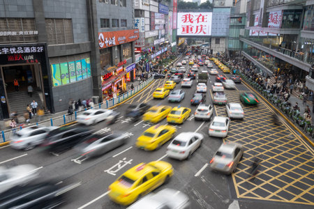 Chongqing, China- 9 Nov 2025: Famous photograph spot where tourists capture Hello Chongqing photo at Guanyinqiao Pedestrian Street in Chongqing, China. With heavy traffic on the roadのeditorial素材