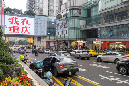 Chongqing, China- 9 Nov 2025: Famous photograph spot where tourists capture Hello Chongqing photo at Guanyinqiao Pedestrian Street in Chongqing, China. With heavy traffic on the roadのeditorial素材