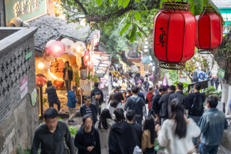 Chongqing, China- 3 Nov 2025: Tourists visit Shibati or Eighteen Stairs, in Chongqing, China.  Shibati is a centuries-old street in Chongqing with traditional houses and stone stairwaysのeditorial素材