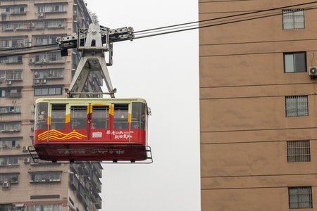 Chongqing, China- 3 Nov 2025: Cable car of Chongqing Yangtze River Cableway crossing the river in Chongqing, China. It has developed into a must-visit attraction for touristsのeditorial素材